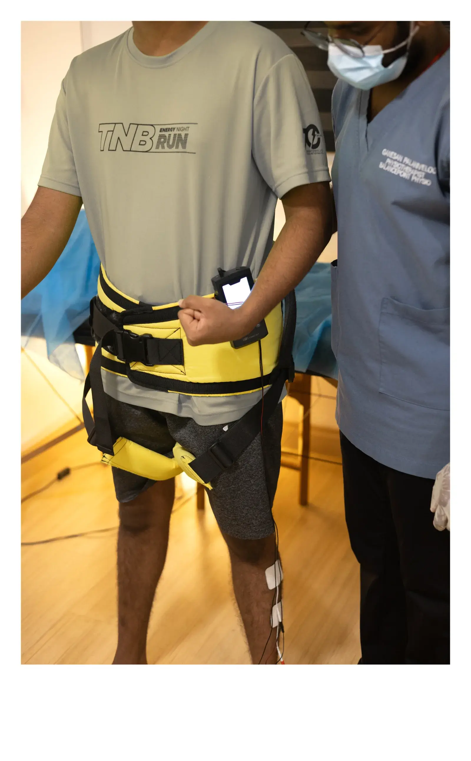 Physiotherapist assisting a patient during supported rehabilitation